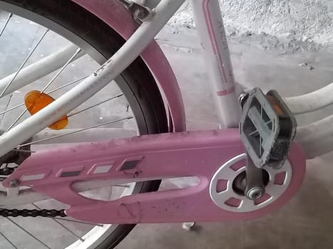 a part of the pink bicycle