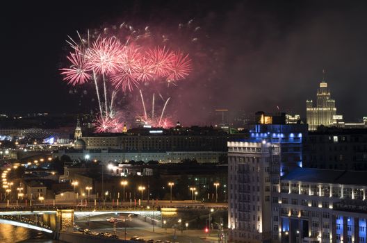 Russia,  Moscow,  view on the city center at night. Fireworks explosions in the night sky.