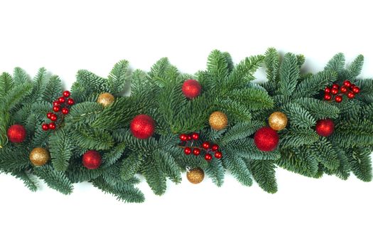 Christmas Border frame of natural noble fir tree branches red and golden baubles isolated on white background