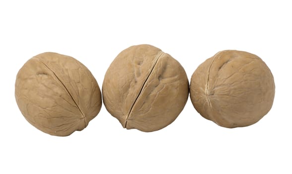 Delicious whole walnuts, isolated on white background.