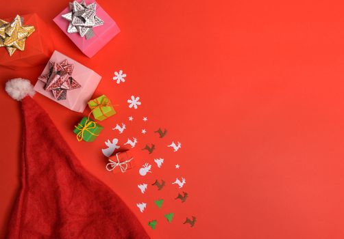 Christmas or New Year background, plain composition made of Xmas decorations and fir branches, flat lay, blank space for a greeting text.
