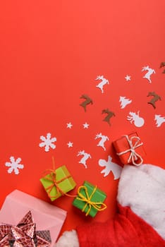 Christmas or New Year background, plain composition made of Xmas decorations and fir branches, flat lay, blank space for a greeting text.