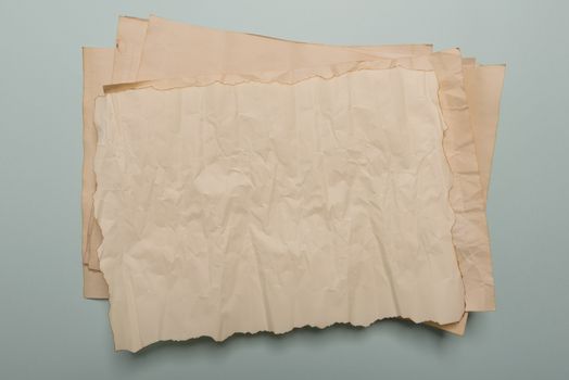 Raven feather, inkwell and old yellowed paper on red background. Copy space. Old letter.