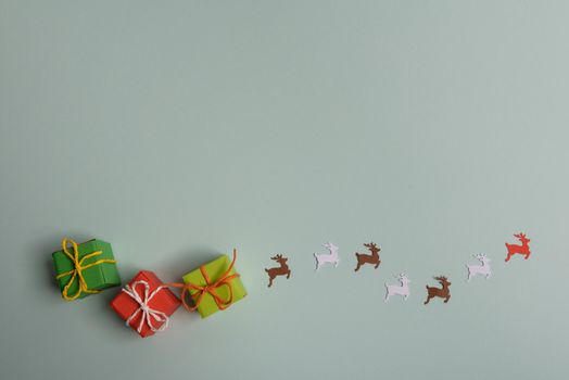 christmas presents nicely decorated with bows and feathers. view from above