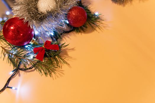 Christmas or New Year background, plain composition made of Xmas decorations and fir branches, flat lay, blank space for a greeting text.