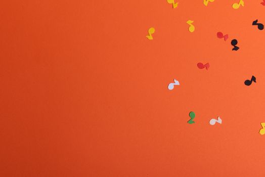 Paper colorful music notes background. View above.