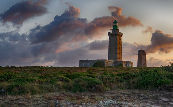 Romantic sunset in France sea coast travel attraction lighthouse