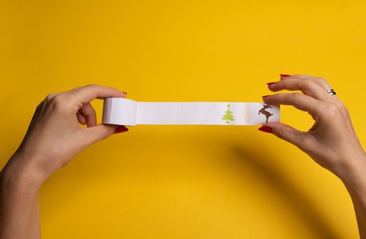 Long twisted expanded empty letter. Copy space. yellow background. View from above