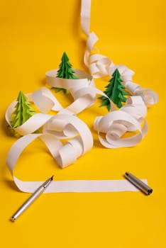 Long twisted expanded empty letter. Copy space. yellow background. View from above