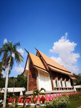 The Thai chapel has a blue sky as the background. Sala Loi Temple, Thailand.