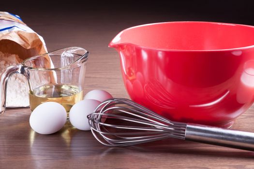 Closeup on ingredients and tools to cook a homemade cake from scratch