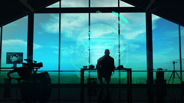 In a film studio with large windows, a silhouette of a man works with a virtual interface.