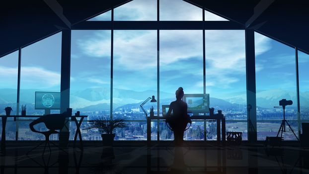 Photographer works at a computer in her office with windows overlooking the mountain landscape.