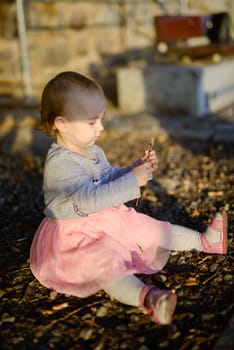 Adorable girl having fun on beautiful autumn day.