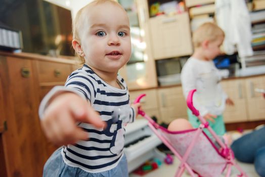 Portrait of 14 months old baby with nipple in bedroom