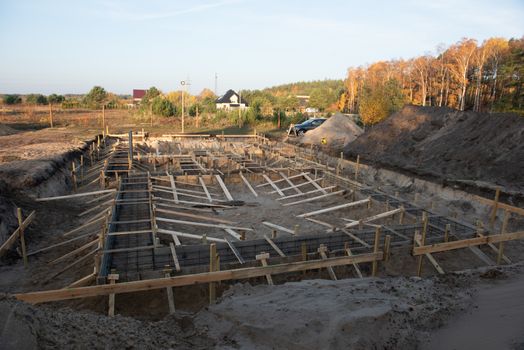 Wooden formwork concrete strip foundation for a cottage.
