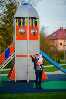 Happy loving family. Father and his daughter child girl playing and hugging outdoors. Cute little girl hugs daddy. Concept of Father's day.