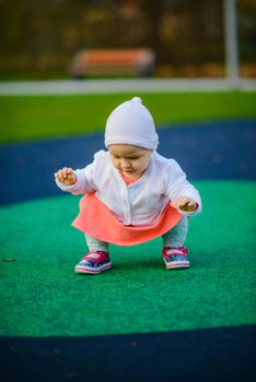 Little girl spending fantastic time on playground. Happy childhood.