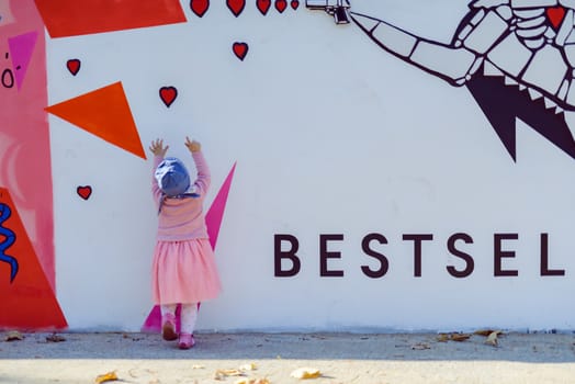 Adorable girl having fun on beautiful autumn day.