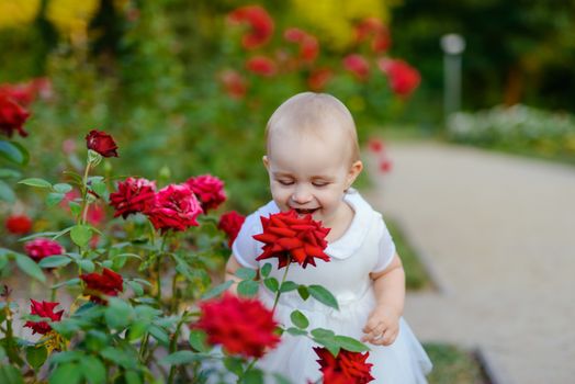 Smiling girl in the park in summer time. Authentic lifestyle image