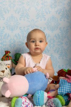 Portrait of adorable baby girl. Childhood.