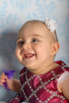 Portrait of adorable baby girl. Childhood.