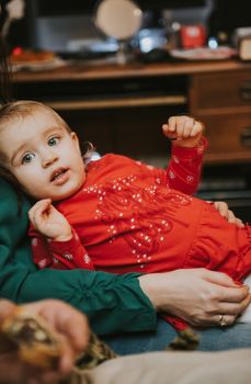 Little girl at christmas time. Christmas tree in background