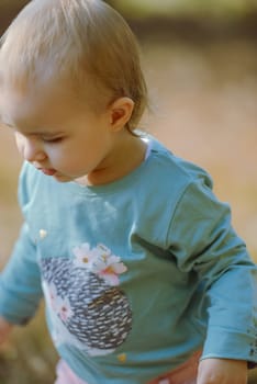 Adorable girl having fun on beautiful autumn day.