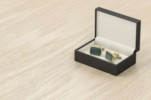 Box with golden cufflinks on wooden table