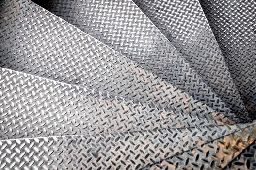 old iron steps spiral staircase abstract background close up