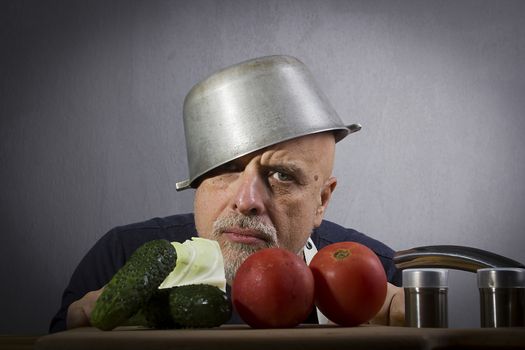 Funny man in the kitchen hides from cooking