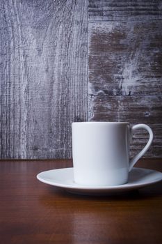 White coffee cup on a wooden table