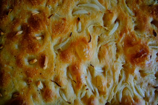 Focaccia is a flat oven-baked Italian bread product similar in style and texture to pizza dough