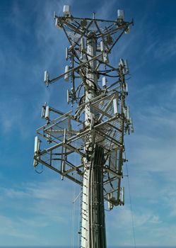 Cellular phone tower on blue sky
