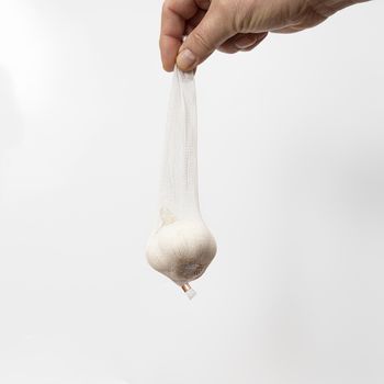 a bulb of garlic in a white retina
