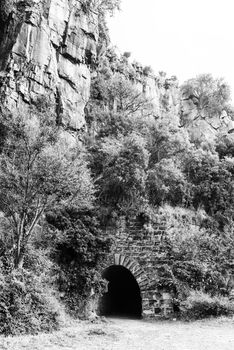 The eastern side of the historic railroad tunnel at Waterval Boven in Mpumalanga. Monochrome