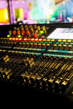 Closeup of an audio mixing control panel