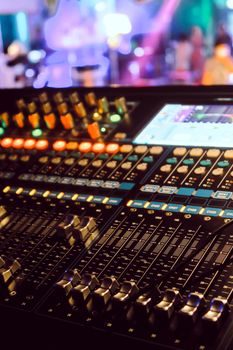 Closeup of an audio mixing control panel