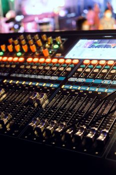 Closeup of an audio mixing control panel