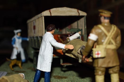 A toy illustration of a medical volunteer corps ambulance and personnel aiding wounded soldiers in a First World War scene