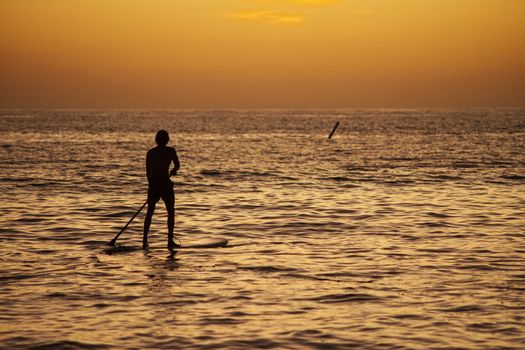 Rowing at the sea at sunset in Bayahibe, Dominican Republic