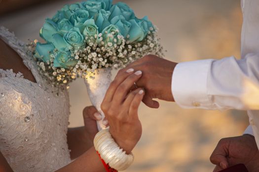 Exchange of wedding rings in caraibic wedding ceremony