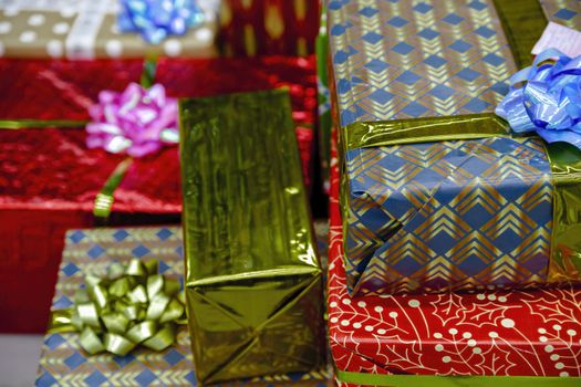 Red, gold, yellow holiday gift boxes. Beautifully designed gifts for friends and family.