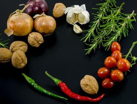 frame of different ingredients foods vegetables and herbs with spce in the middel for text