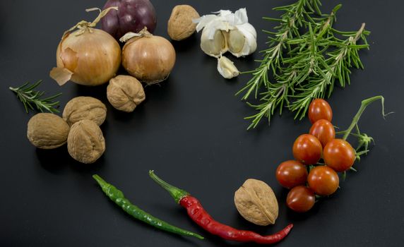 frame of different ingredients foods vegetables and herbs with spce in the middel for text