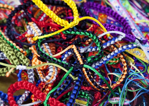 Handmade woven bracelets at a Vietnamese market