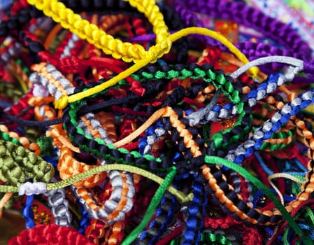 Handmade woven bracelets at a Vietnamese market