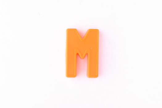 Colorful capital letter over white background