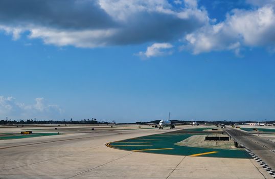 Planes Taxxing on Runway in a Commercial Airport