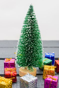 Christmas composition decorations, minimal green fir tree branches with snow and gift boxs on white background. Merry Christmas concept. Copy space for text